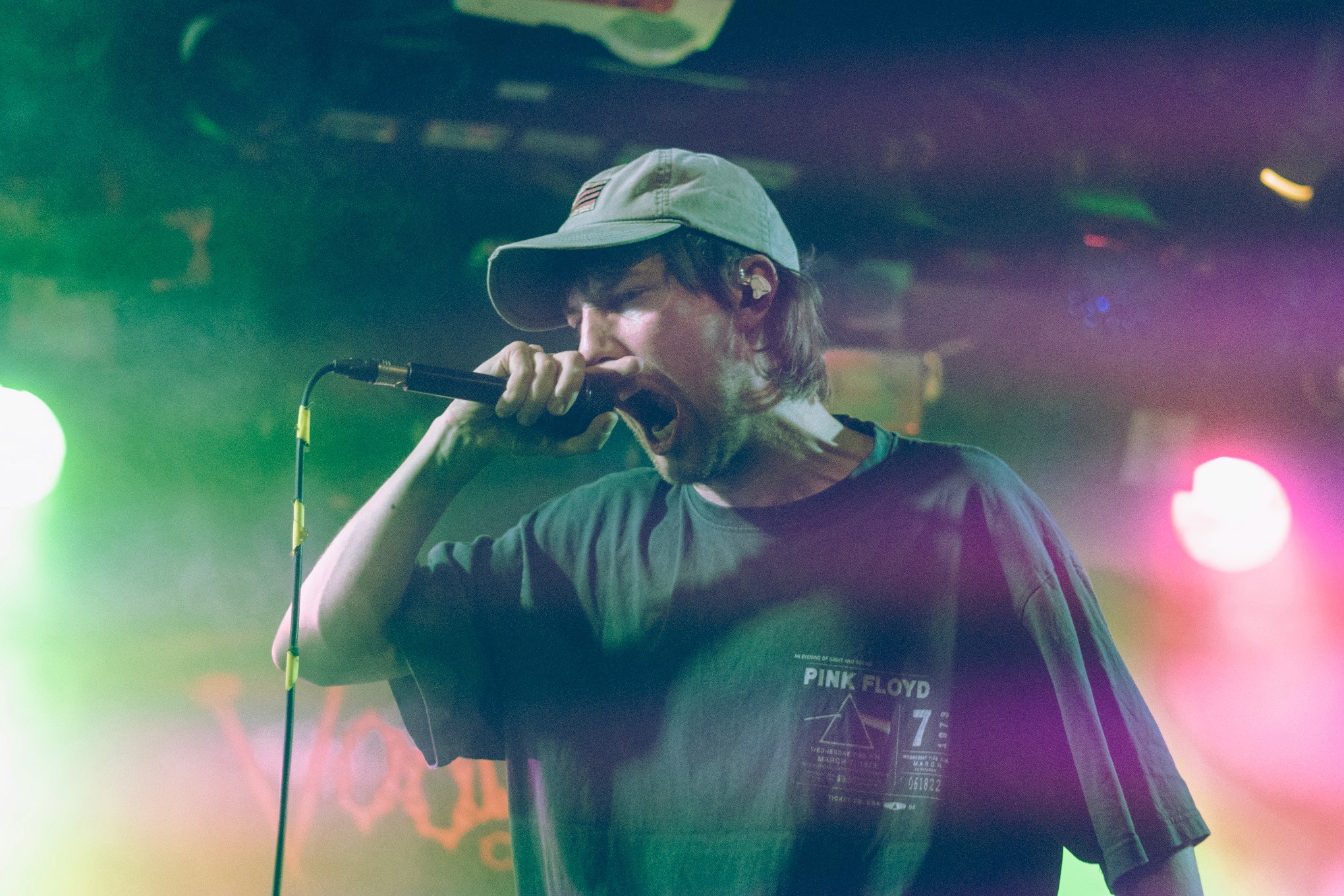 Vocalist screaming into a microphone