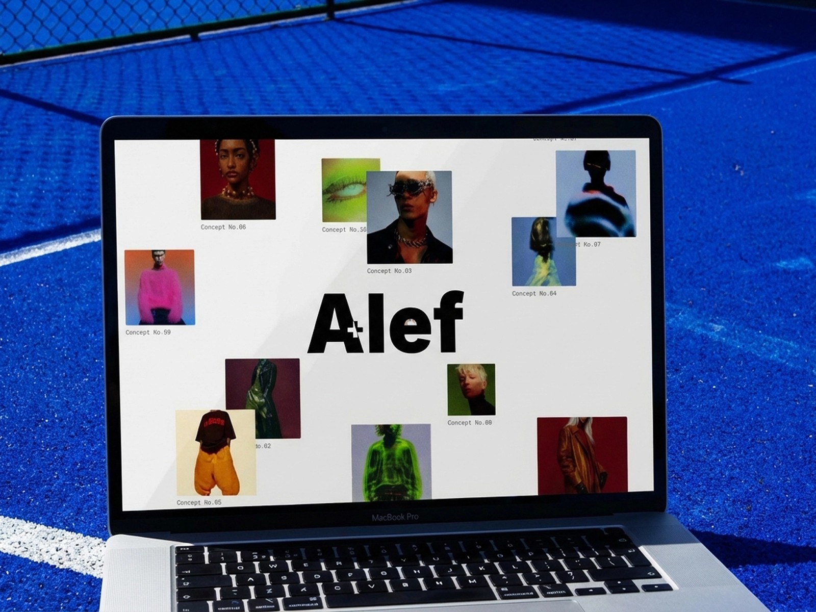 Laptop on blue surface displaying "Alef" and various portrait images.