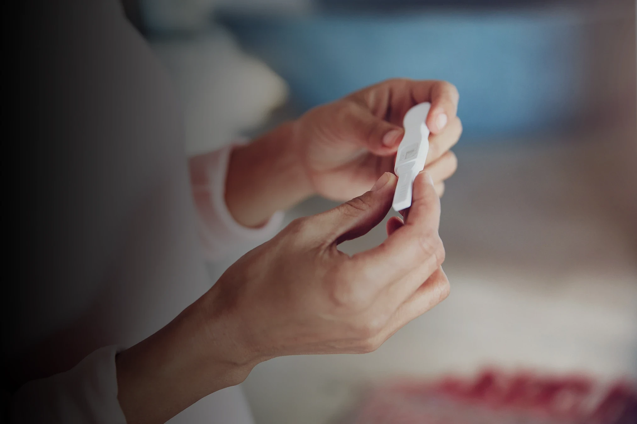 Woman checking pregnancy test after Flouria’s Fertility care path