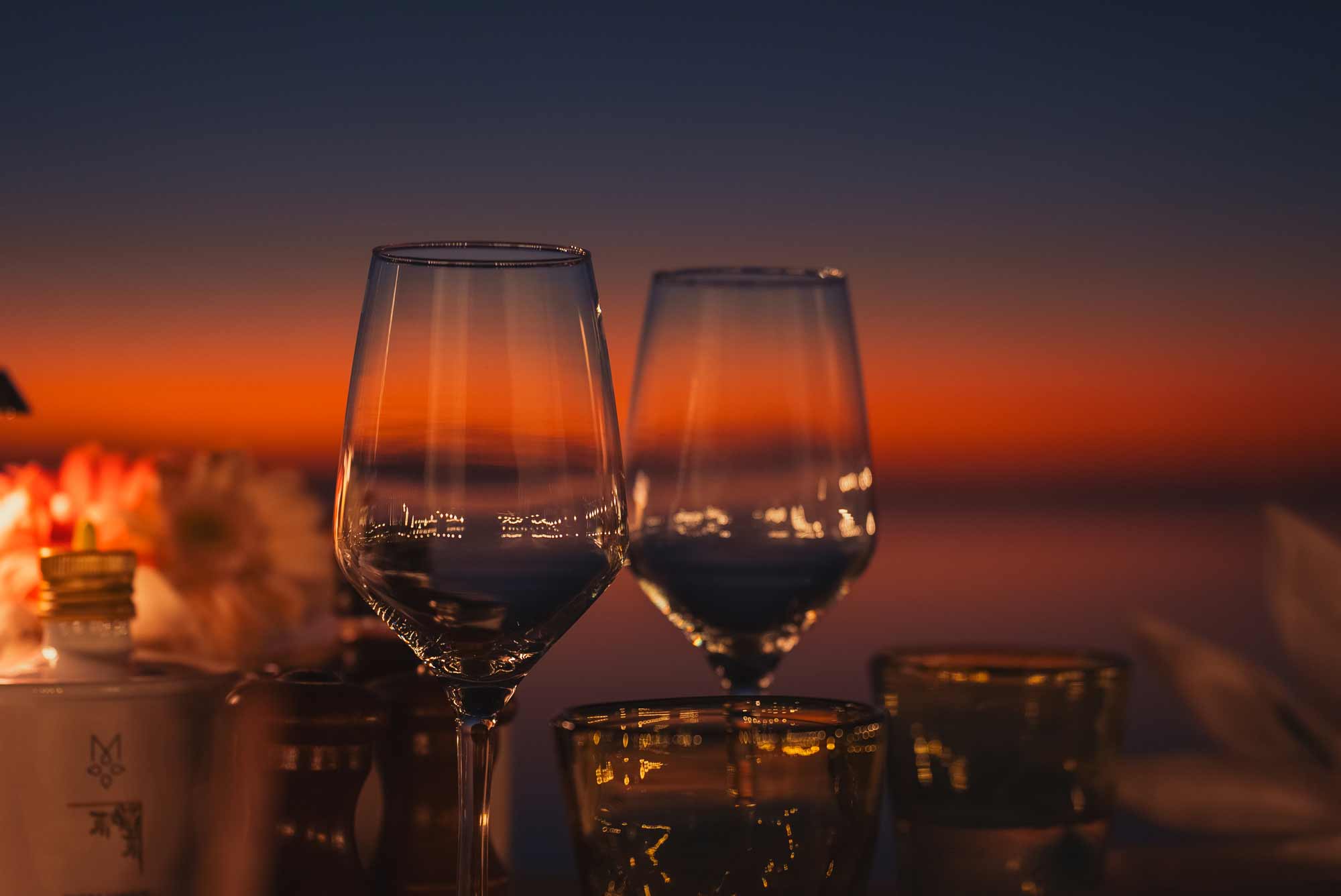 Wine glasses against sunset, filmproduction ad for a hotel in mauritius
