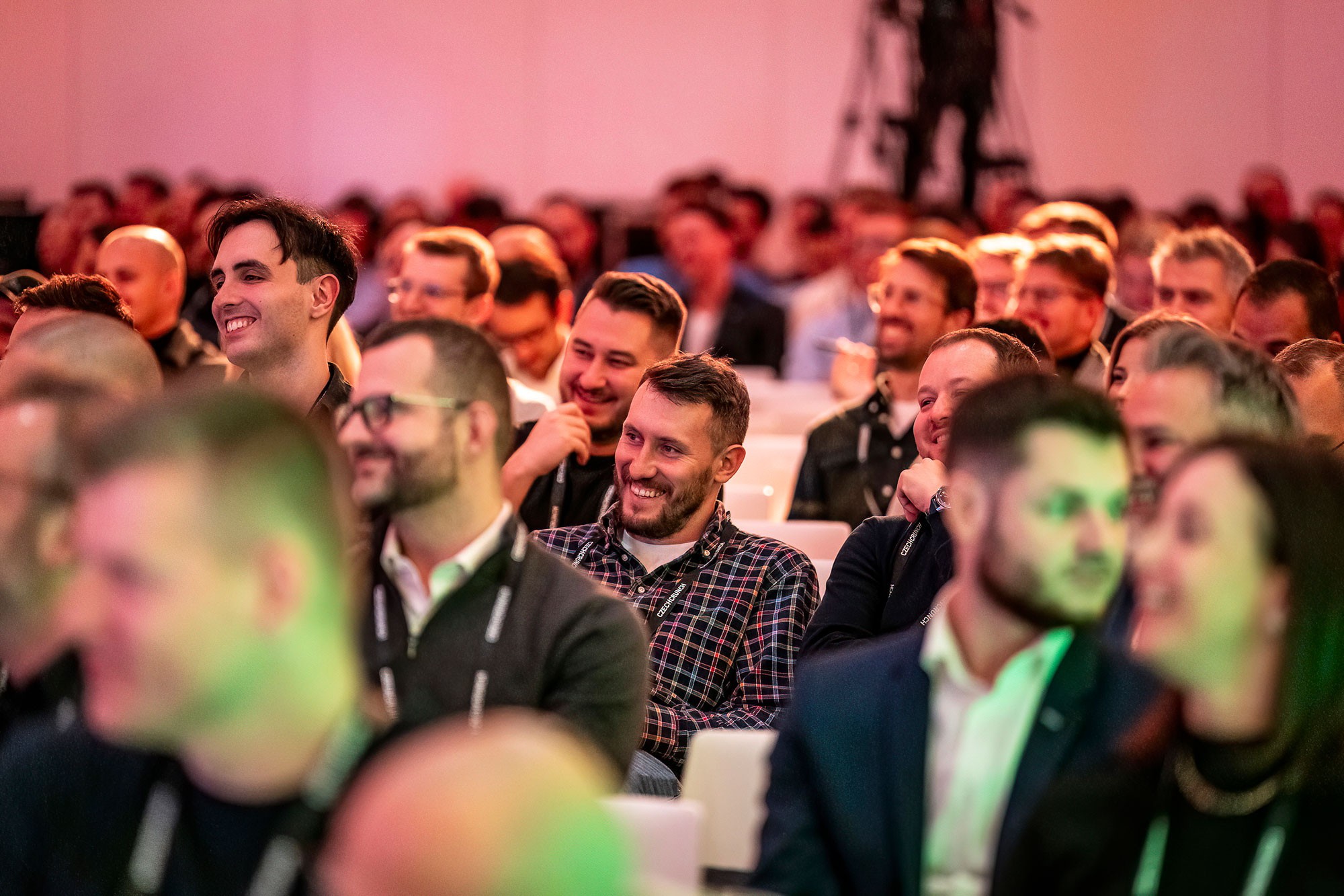 Audience reacting during a keynote session at Money Maker conference in Prague