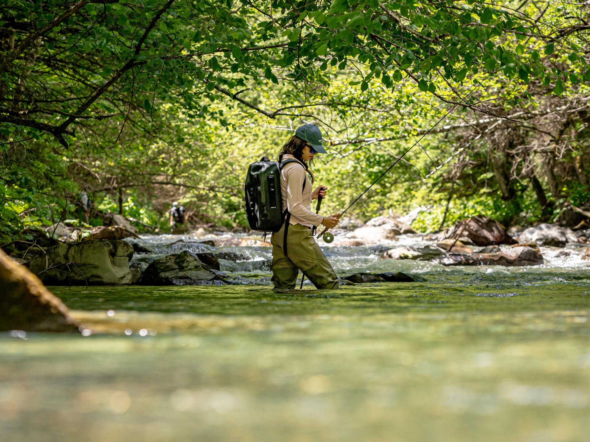 Fishing in the Dolomites: spotting wild trout and Arctic char in pristine waters framed by the majestic Brenta Dolomites