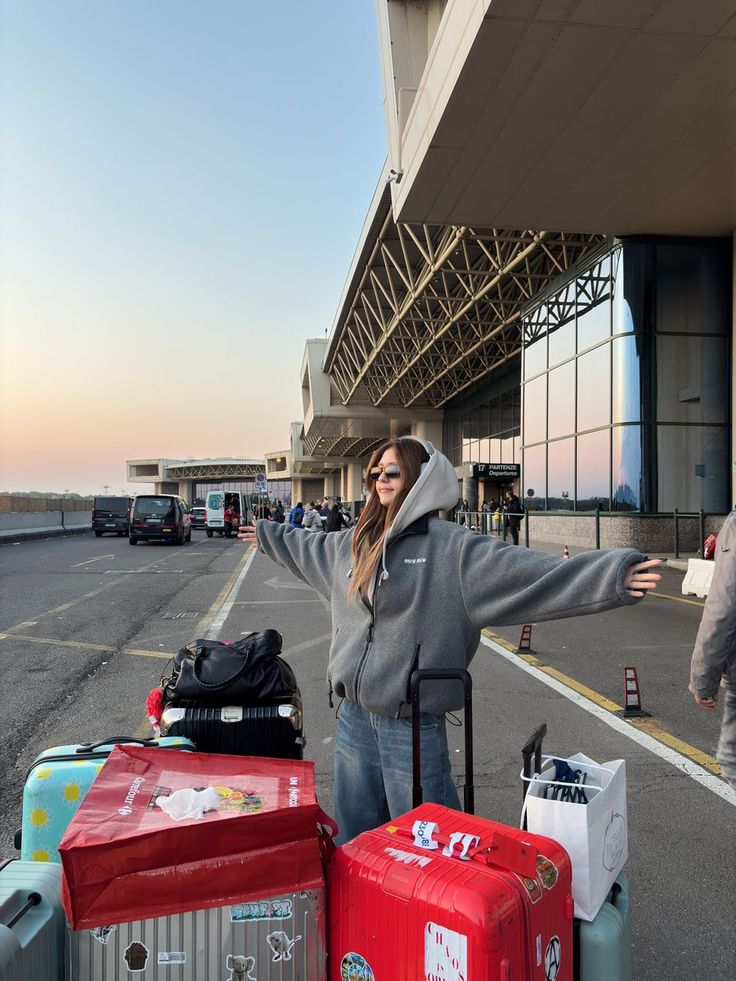 two people sitting at a table with laptops