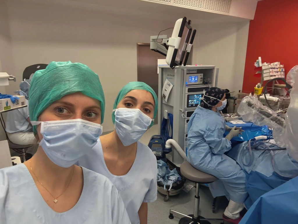 two female nurses in an operating room with blue scrubs on