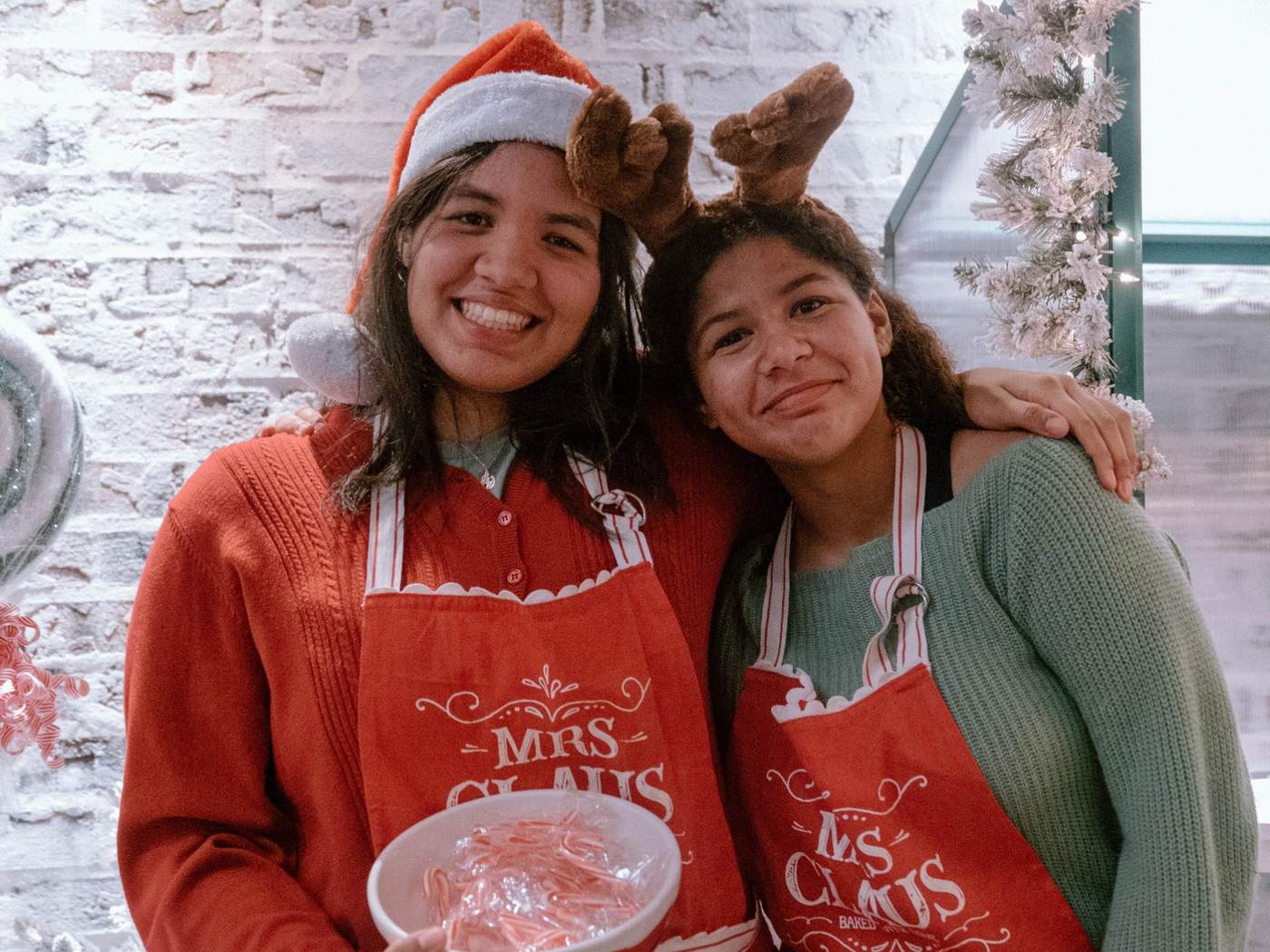Volunteers handing out candy canes