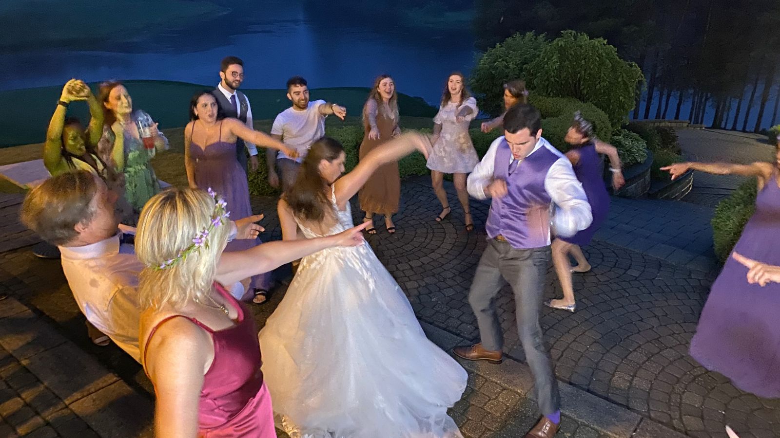 Midnight dancing with bride, groom and wedding party.