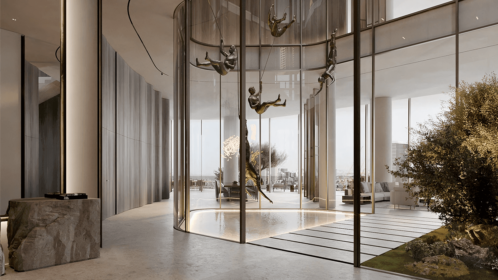 Interior atrium at Ava residences featuring a central olive tree and views of the Burj Al Arab.