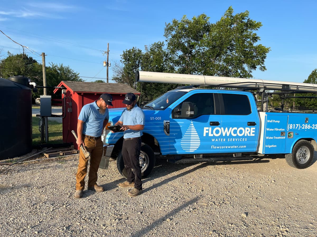 Flowcore technician walking a Dallas homeowner through well repair findings