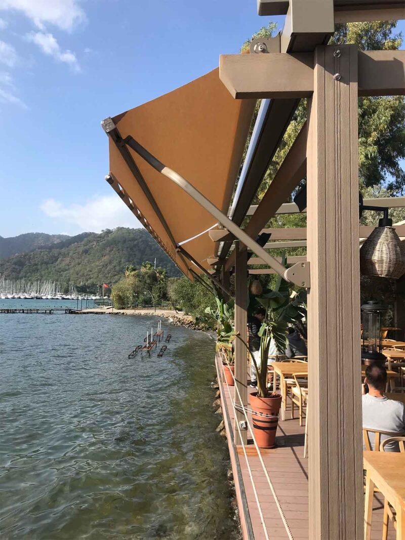 two people looking at a tablet and smiling