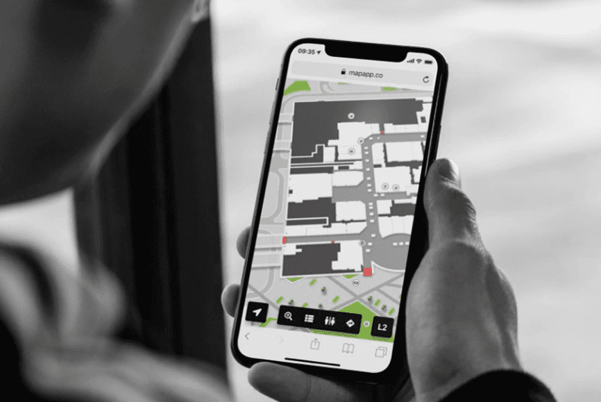 A photo of someone using an interactive wayfinder on their phone