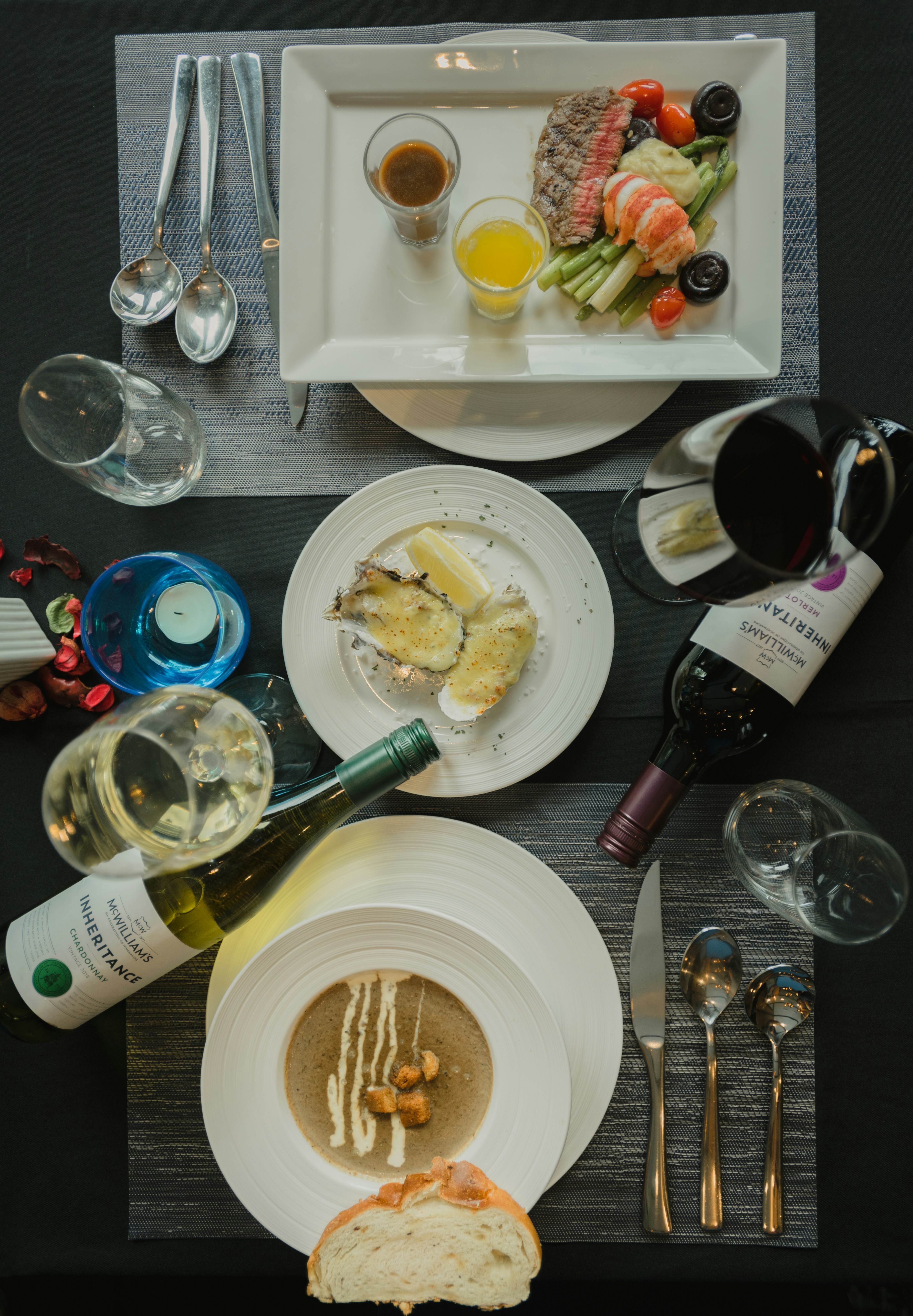 white ceramic plate with stainless steel fork and bread knife on table