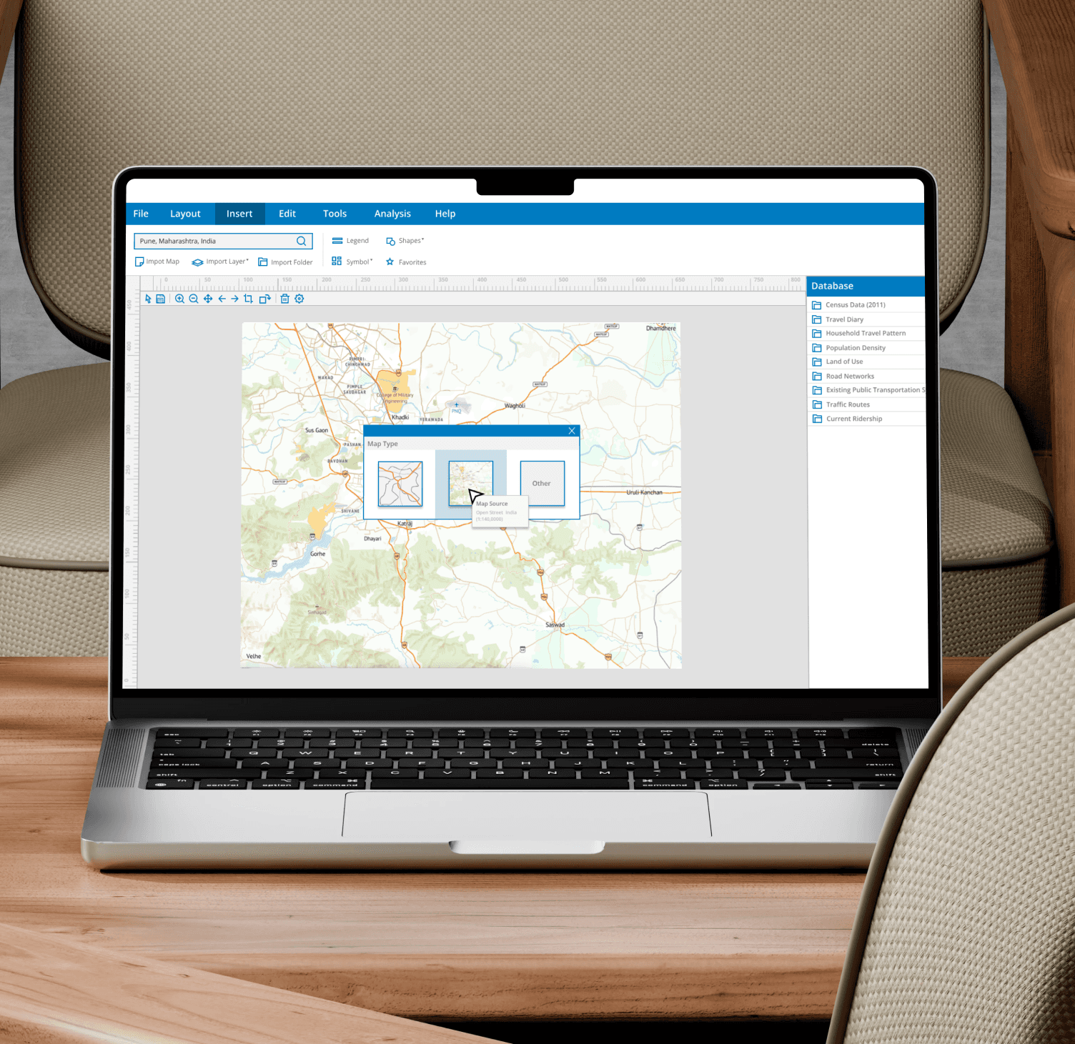 A laptop on a chair with screen showing a reporting dashboard page