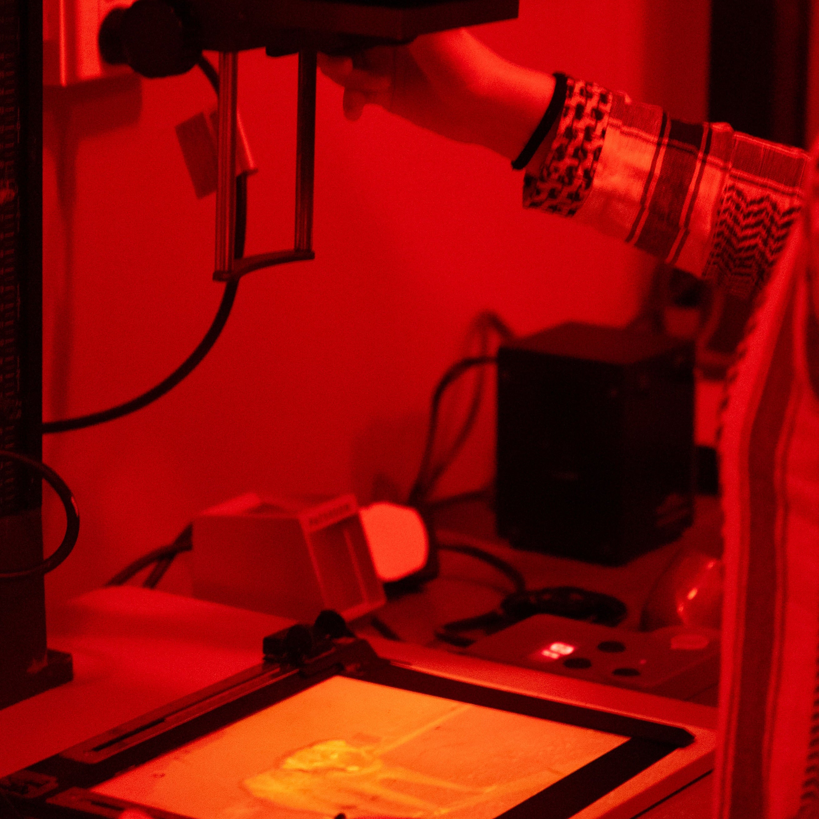 35mm film enlargement process with a red light in darkroom