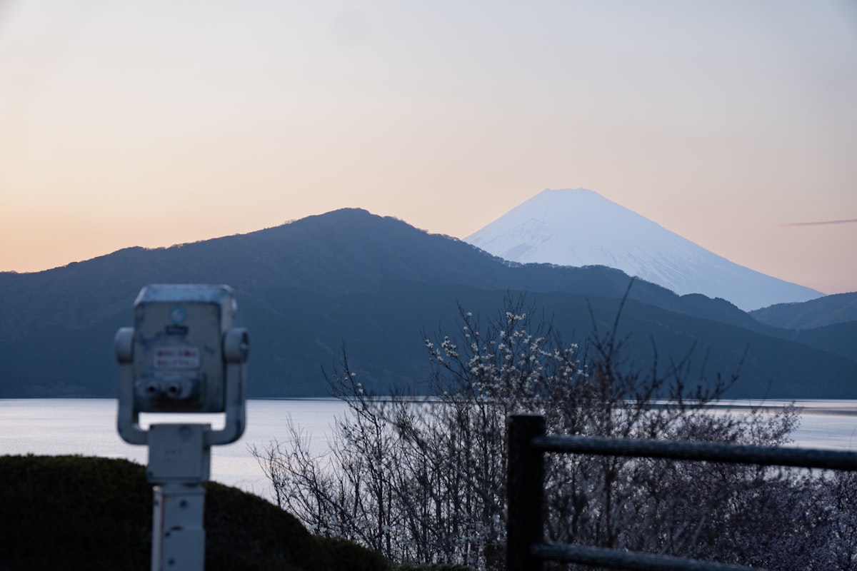 Mt. Fuji with snow-capped peak rising above Lake Ashi in Hakone on a clear day