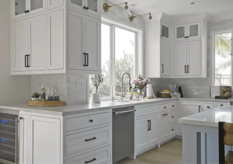 Close view of the kitchen sink wall, highlighting the cabinetry and layout in the Dana Point Remodel. Photo by Todd Huge.