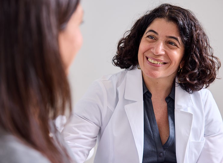 Carolyn Rowan Center clinician listening to a women