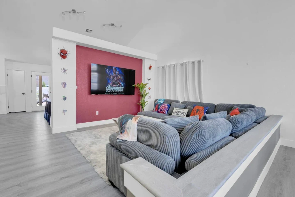 Cozy superhero-themed living room with comfy couches, high ceiling and 75" TV, SuperHero Retreat in North Las Vegas