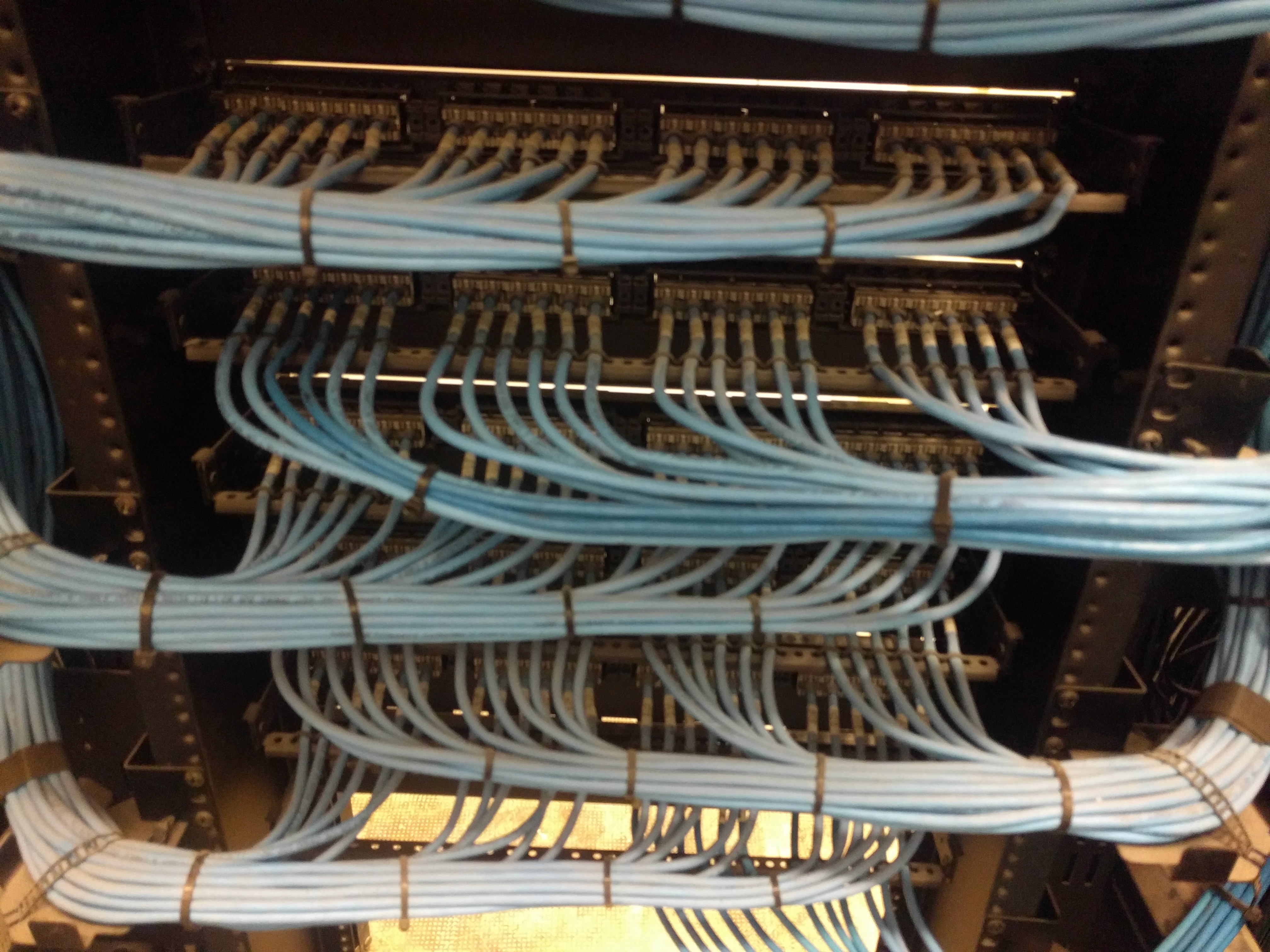 woman sitting around table holding tablet