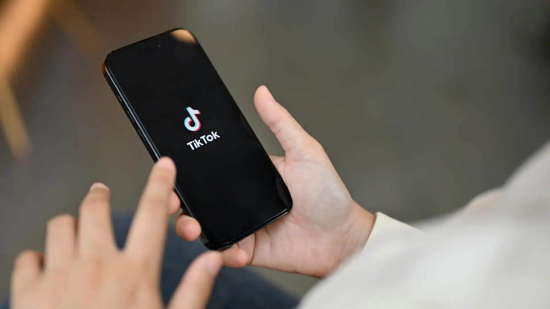 The TikTok app, representing the AI-driven digital ecosystem where trust is the core metric.