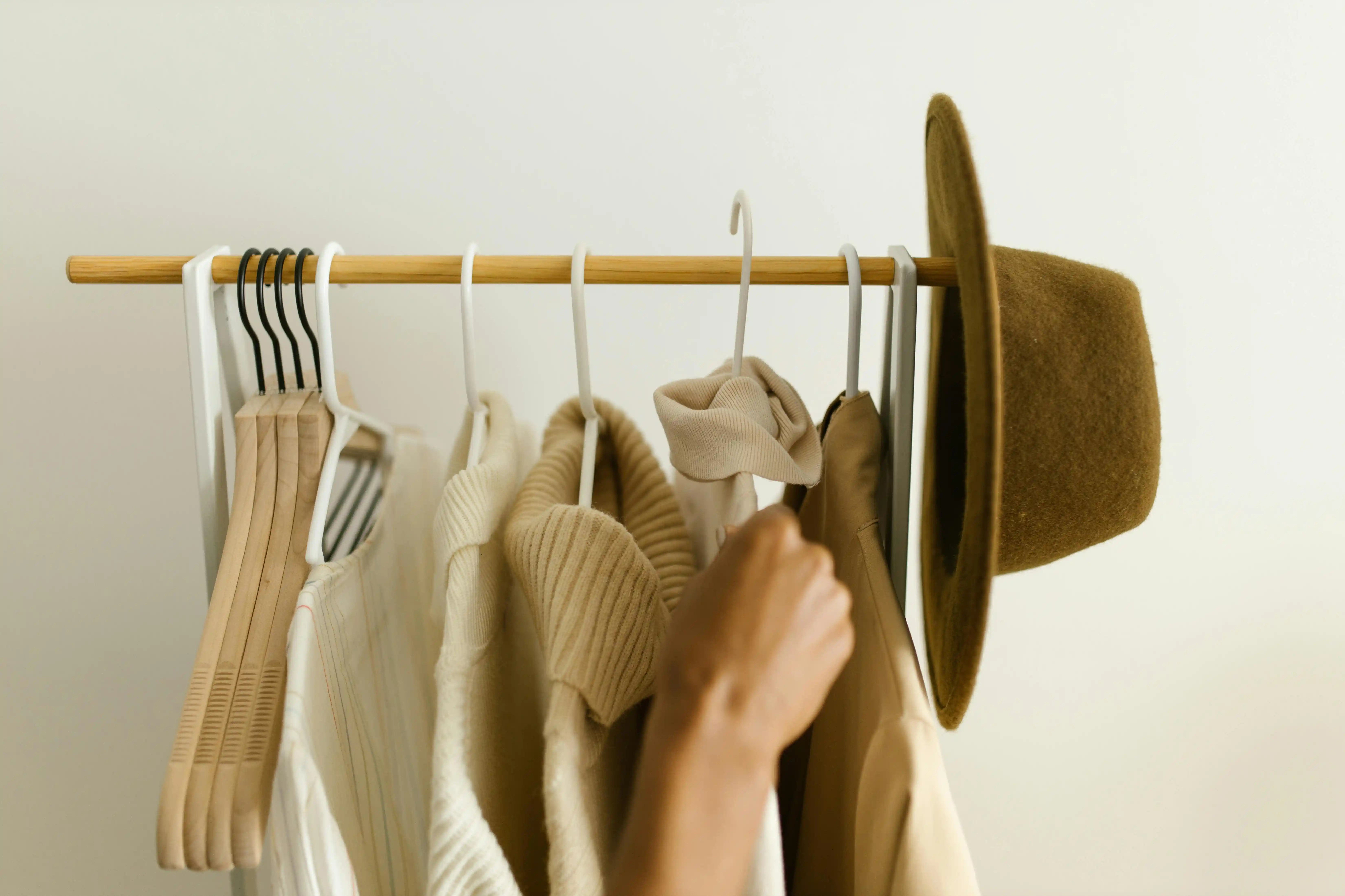 Hanging of Clothes on a Clothing Rack