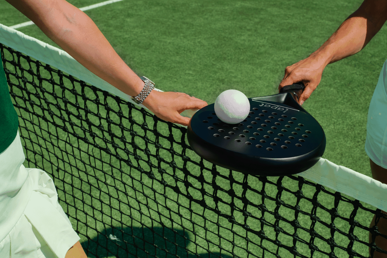 A group of people praticing yoga on the beach in the morning