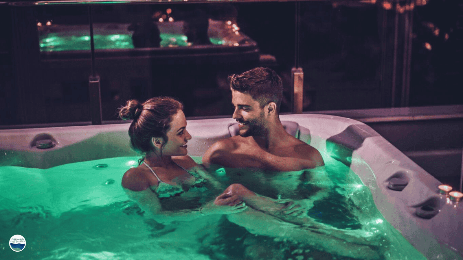 Relaxing in inground jacuzzi spa in backyard during evening