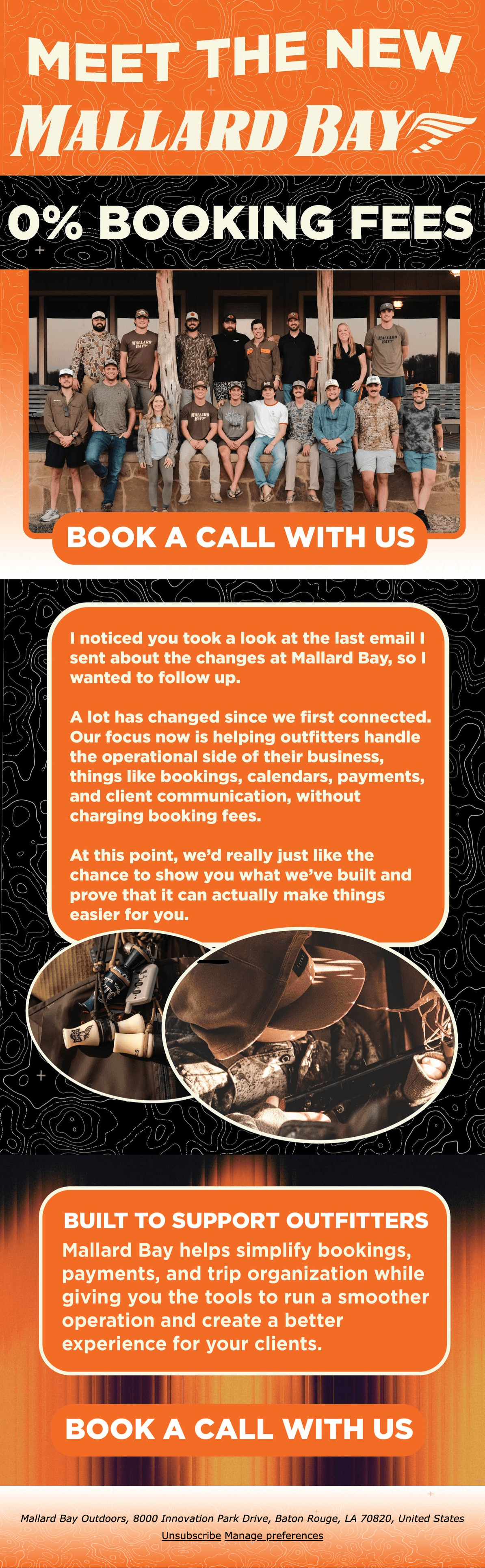 Black and white photo of two people looking at a computer screen with papers on wall