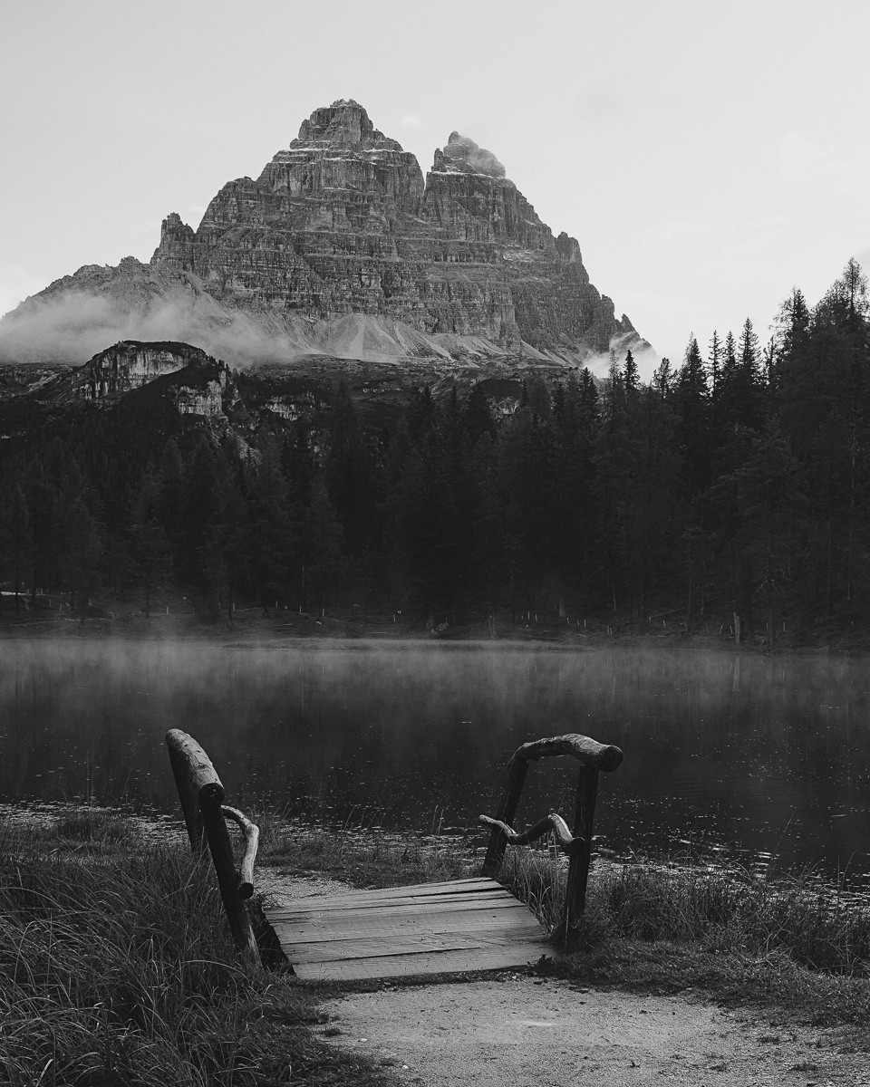 dolomiti mountain with wooden bridge and lake