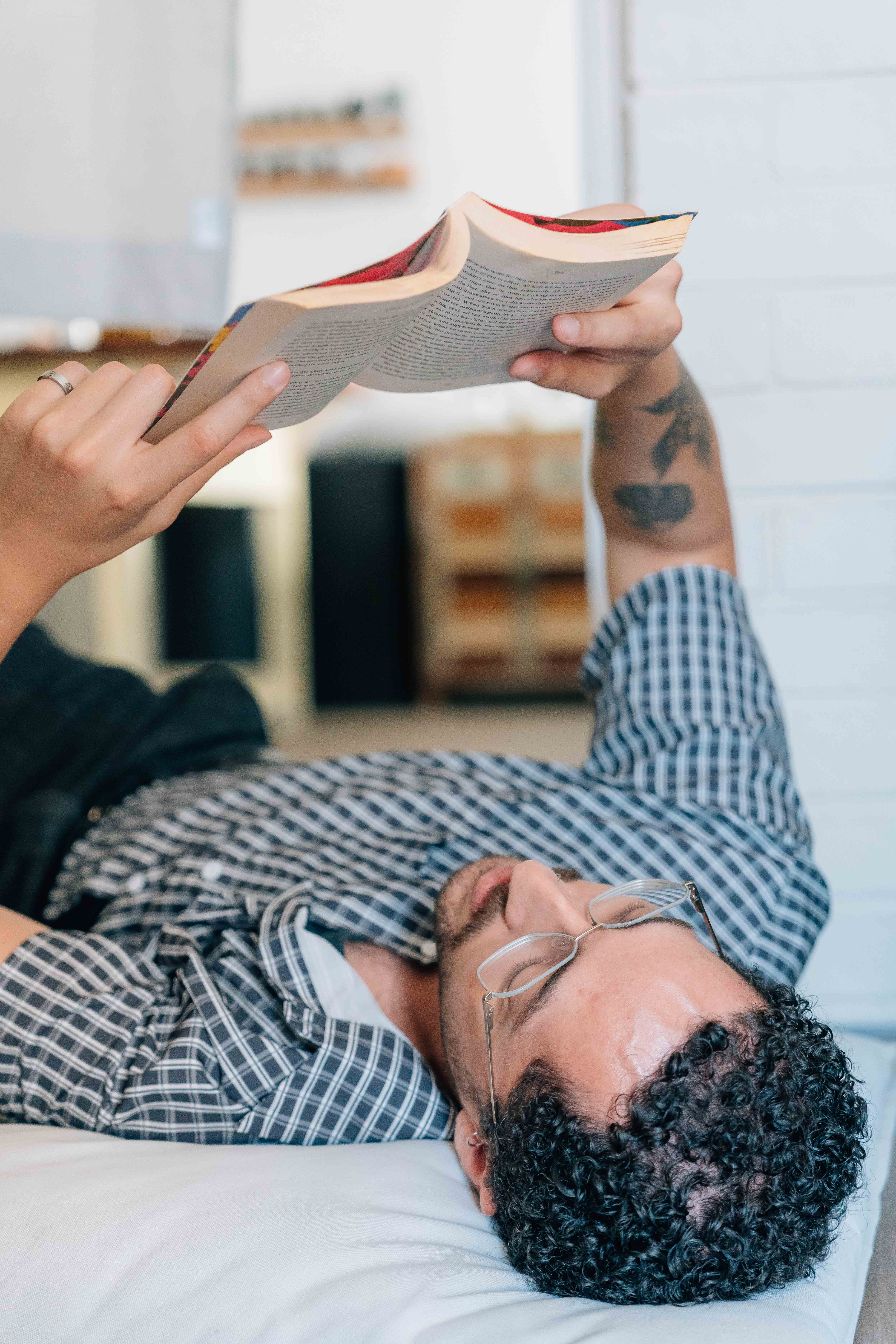 group of people sitting on bench near trees duting daytime
