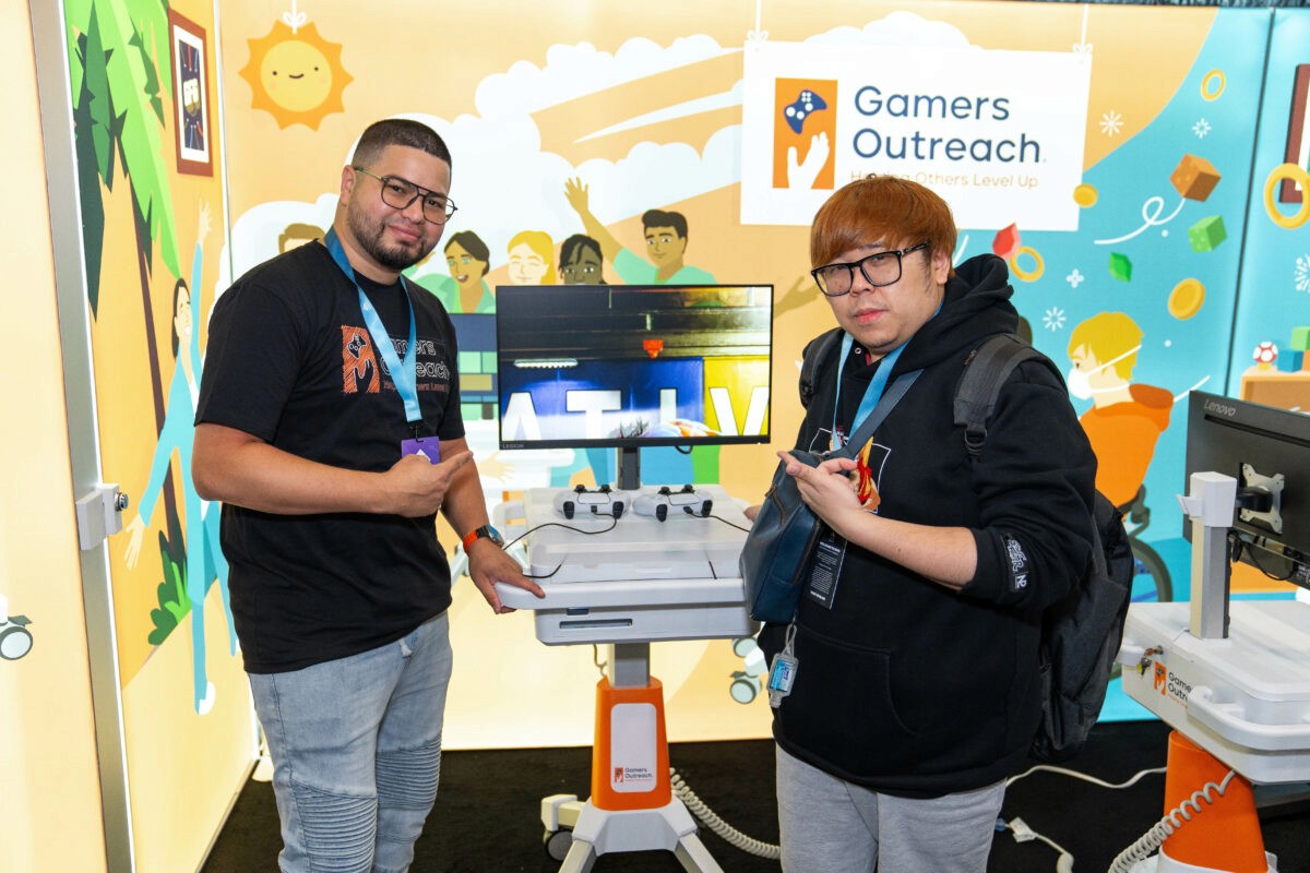Justin Wong and Edwin Nolasco with a GO Kart 3.0 unit in the Gamers Outreach booth.