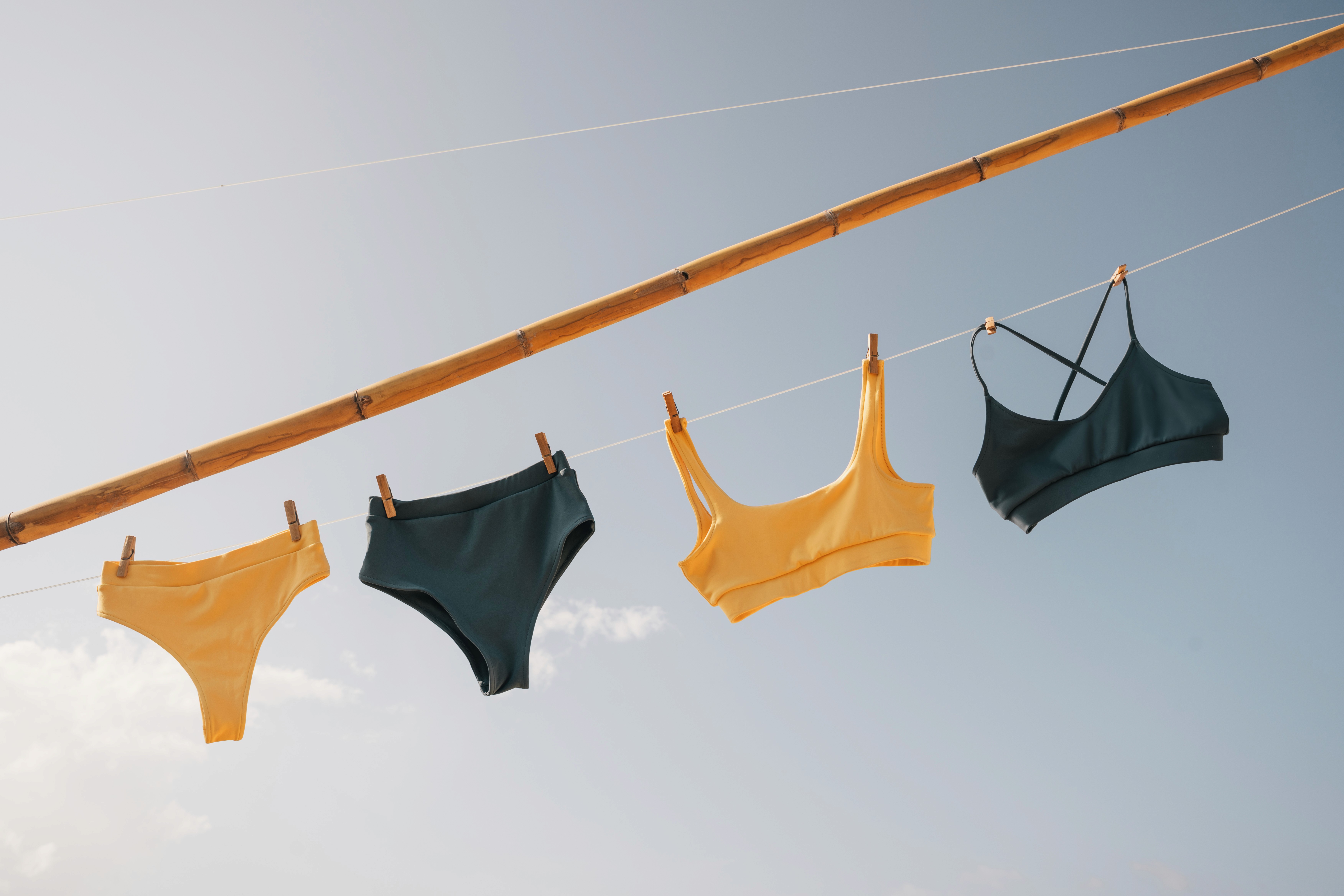 Blue and yellow bikini handing on a string 