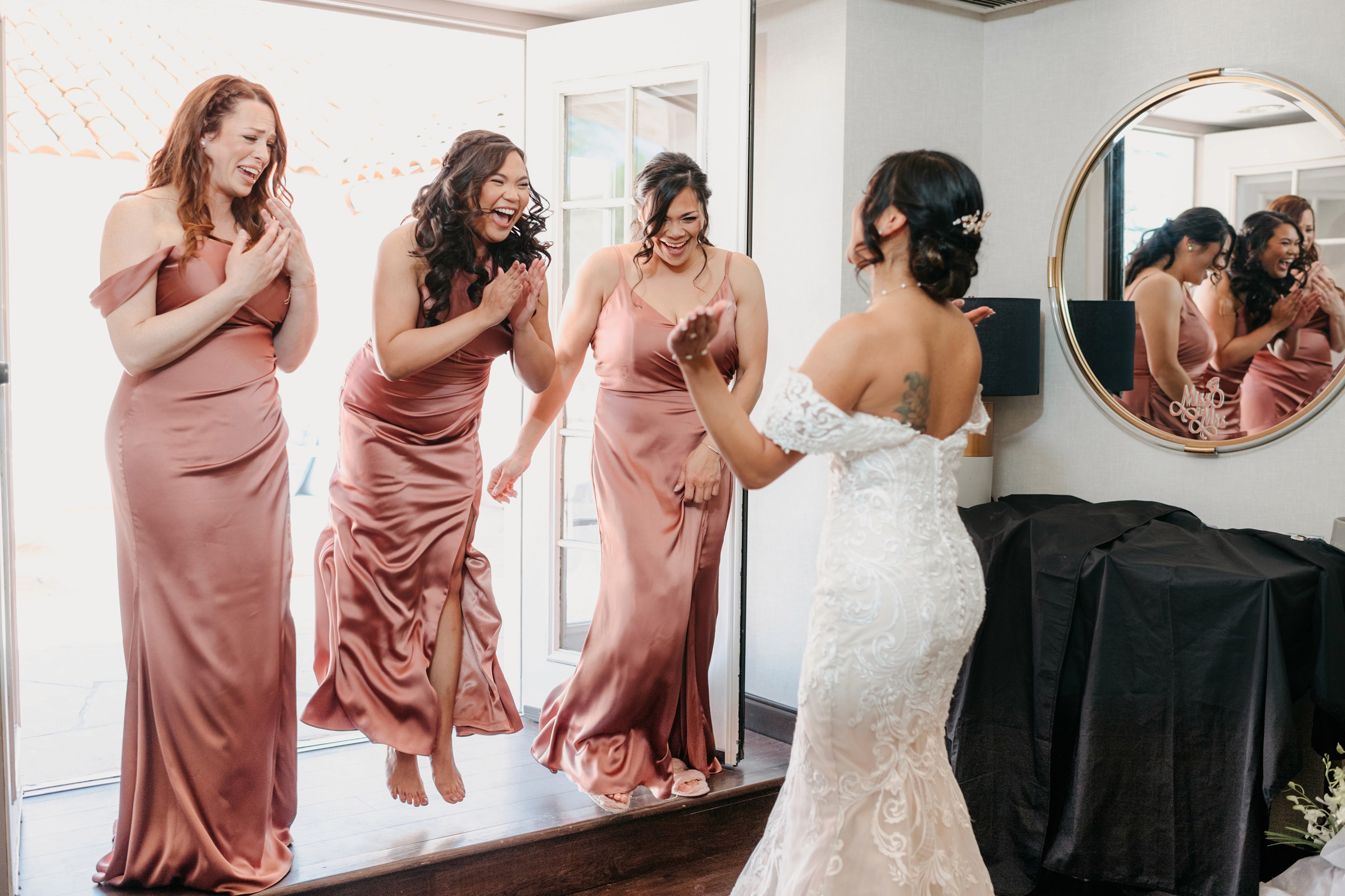 Flat lay wedding details with bouquet, rings, and sparkling bridal heels