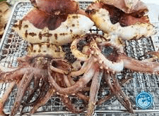 Grilled squid on barbecue rack