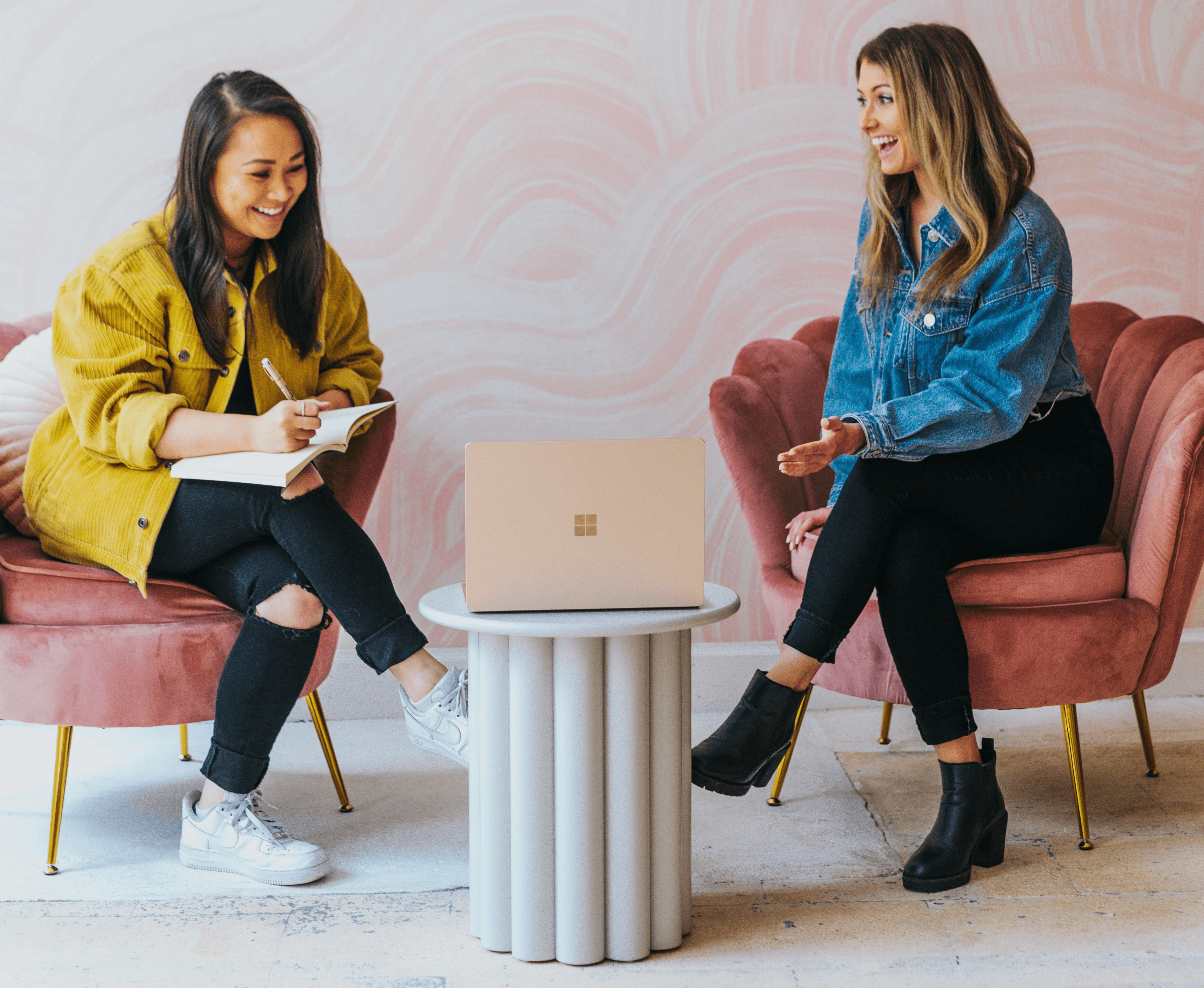 3 women sitting on chair