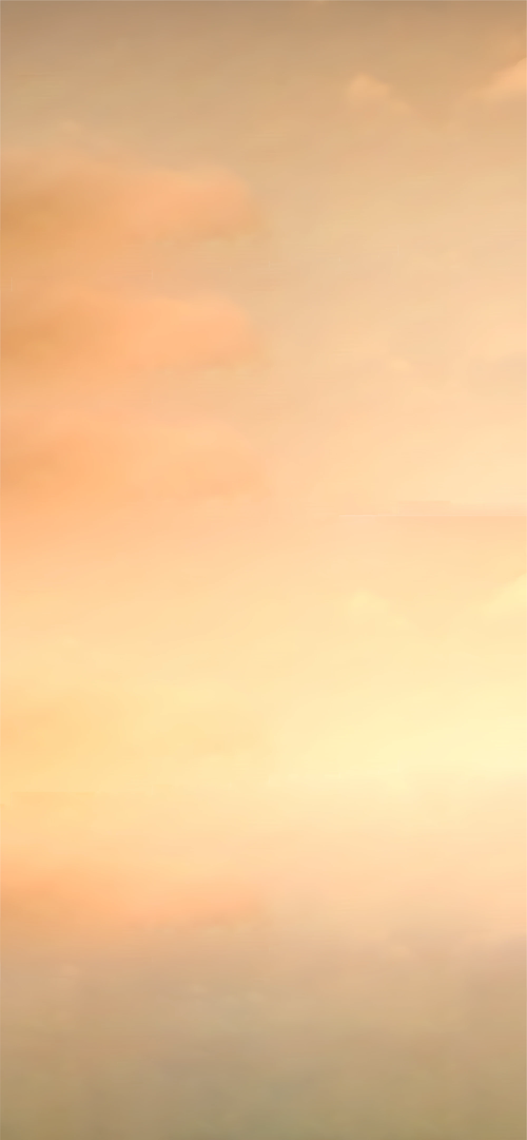Soft sunset sky with warm orange and peach cloud tones