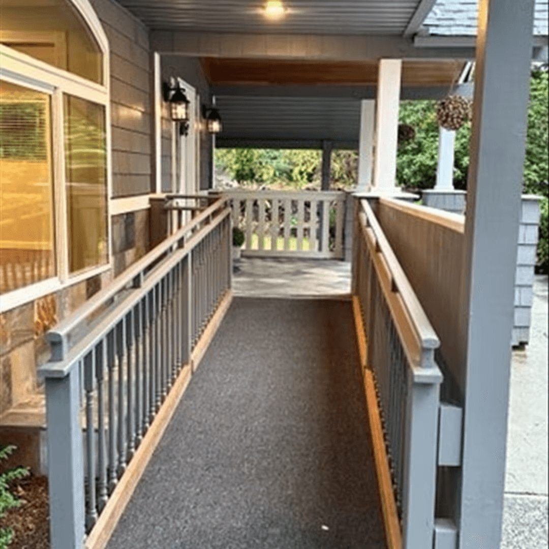 Accessible front entrance of an adult family home featuring a wheelchair ramp for safe, easy entry.