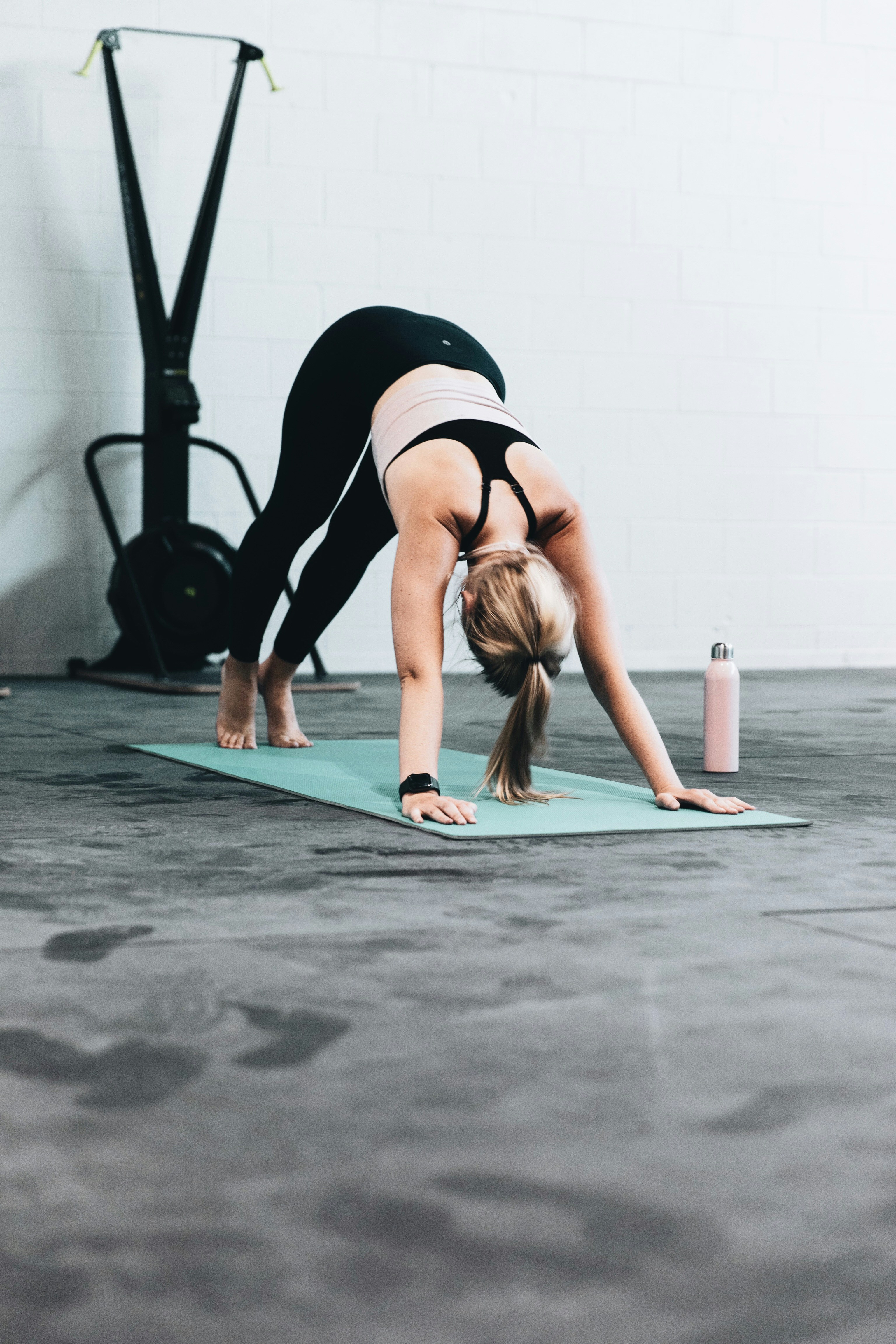 woman doing pilates on a mat