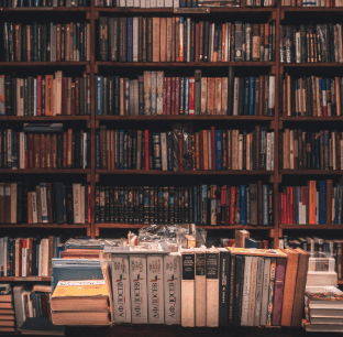 White building with red lighthouse under clear sky.