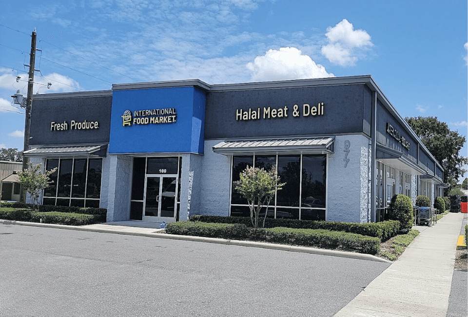 Street view of International Food Market Orlando, featuring sections for fresh produce and halal meat & deli, located at 977 N Goldenrod Rd, a popular ethnic grocery store in Orlando, Florida.