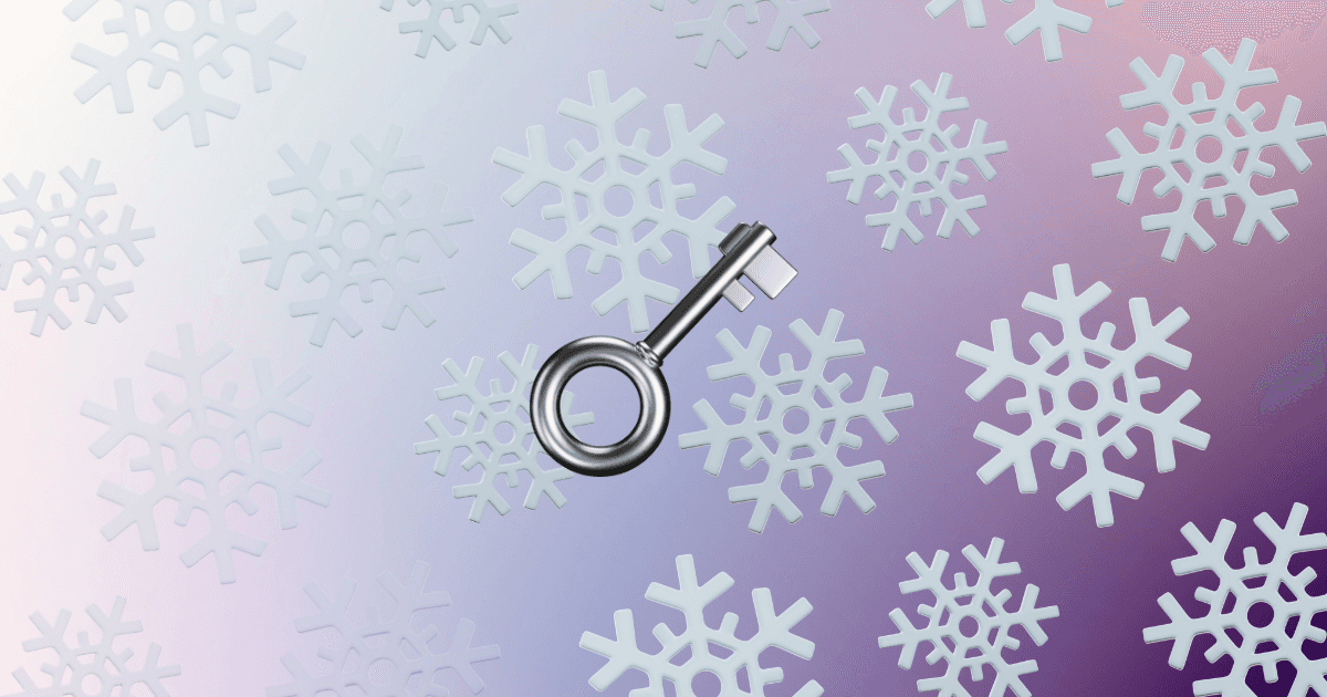 A silver key on top of a background of snowflakes and a purple gradient