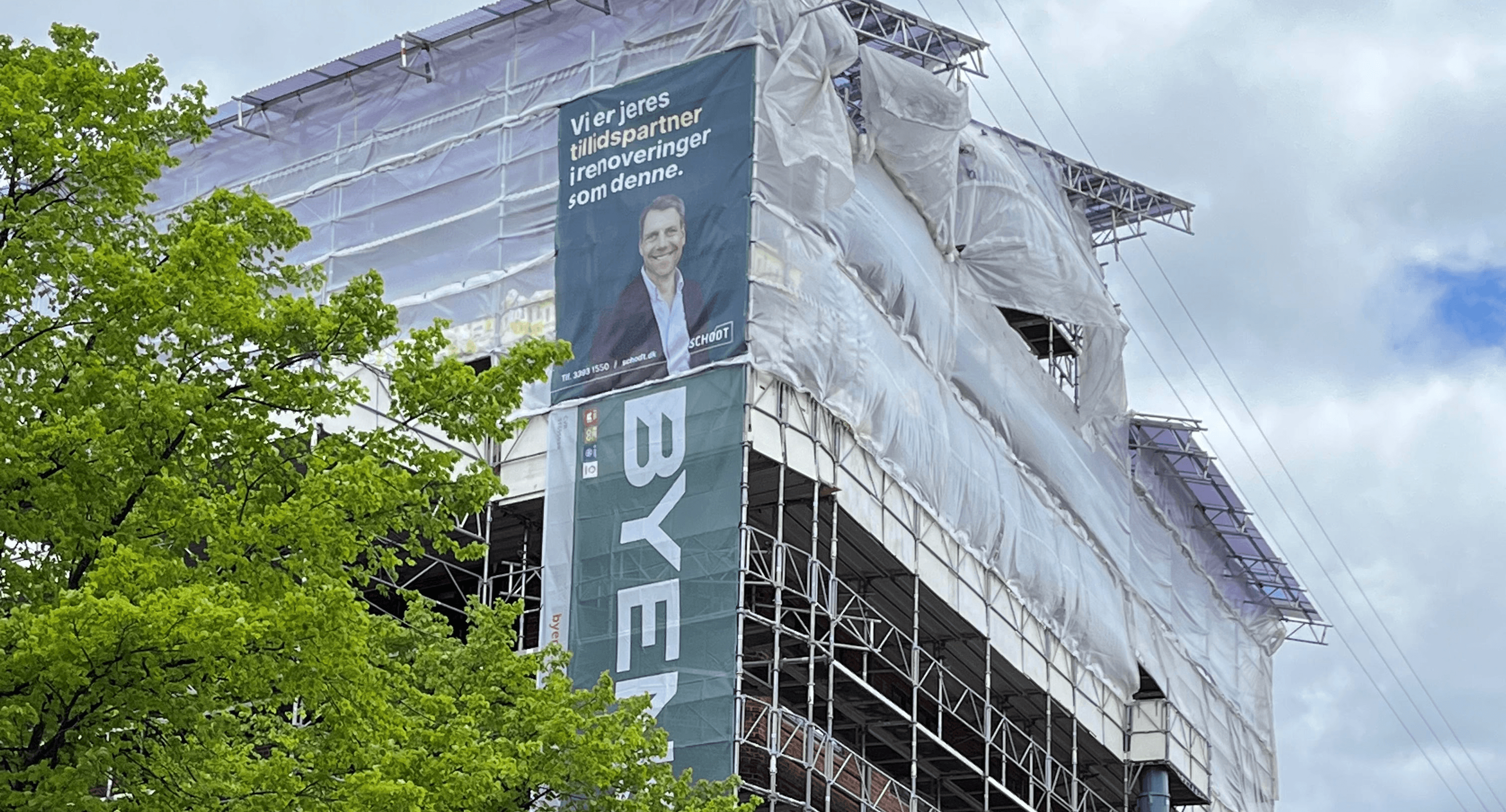 a row of buildings on the corner of a street