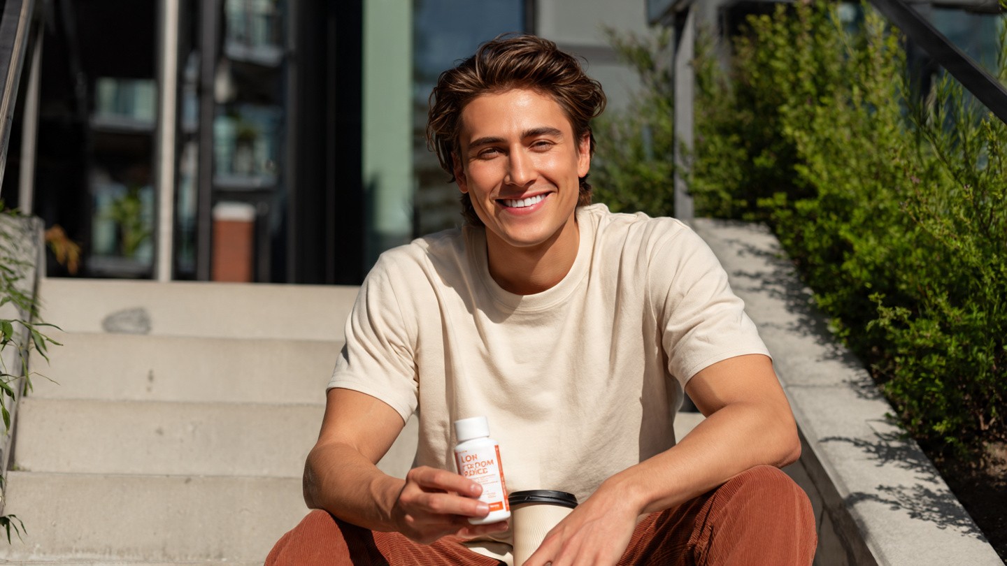 young_man_sitting_on_balcony_steps_in