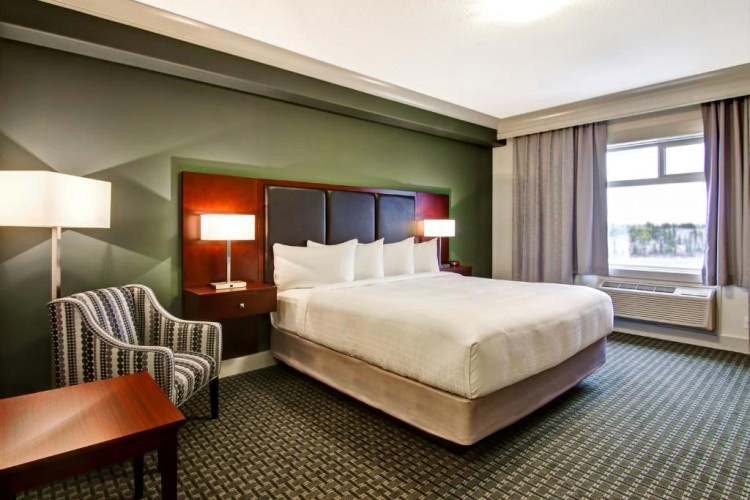 sunloungers fronting buildings near mountain