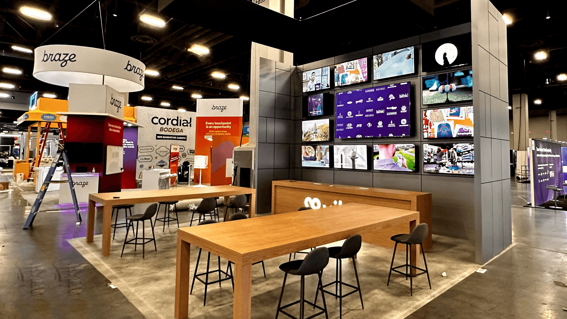 Caesars Forum rental booth planning reference with branded walls, counters, meeting space, screen support, storage, and modular booth layout