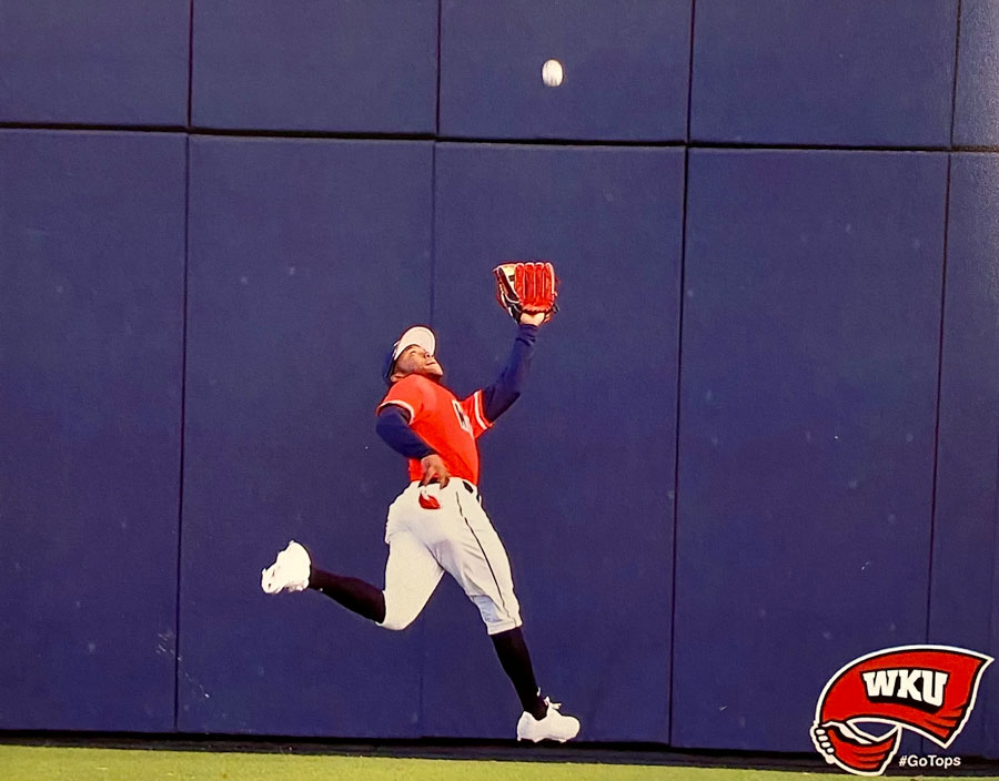 Junior Coleman cathing a flyball in a college baseball game