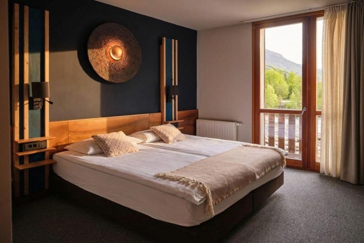 sunloungers fronting buildings near mountain