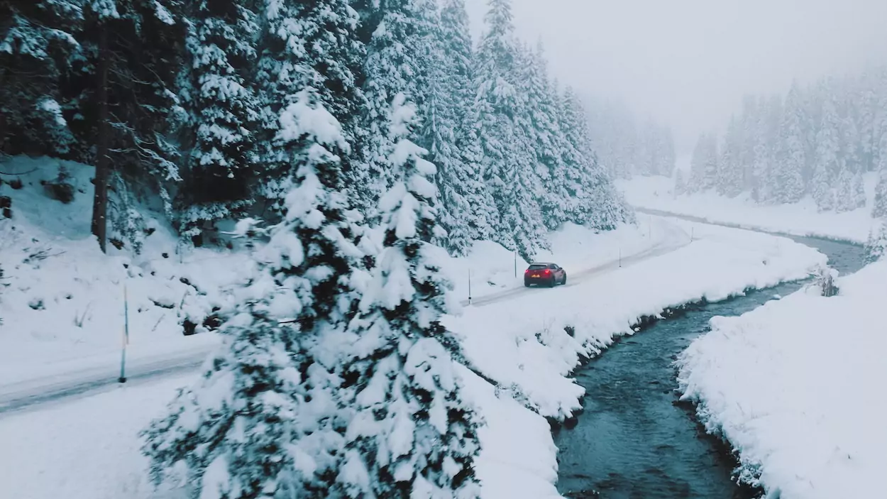 Mazda car driving in snowly landscape