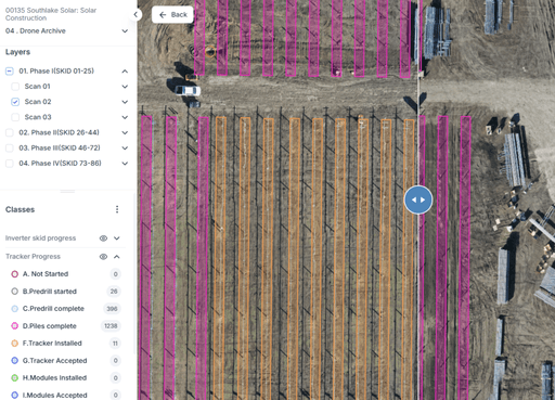 Aerial view of a field with rows marked in alternating colors, showing agricultural layout and boundary lines.