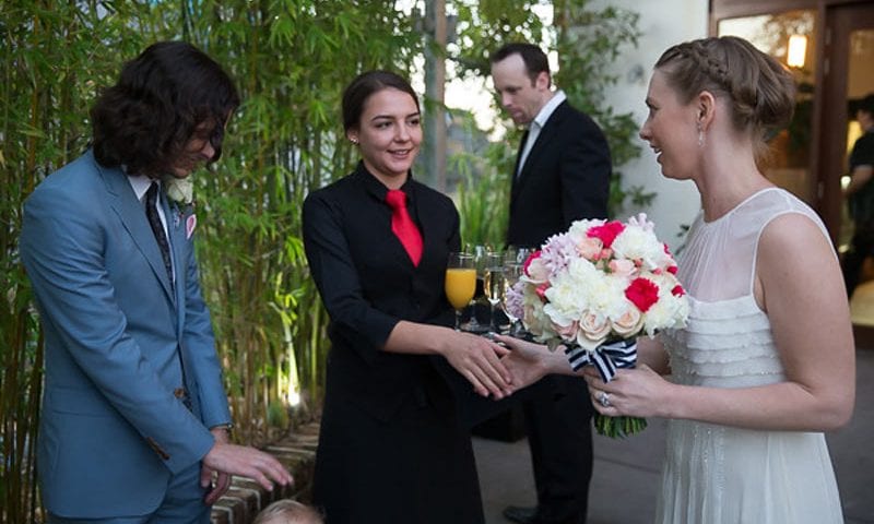 Bride & Groom during beverage service at their wedding