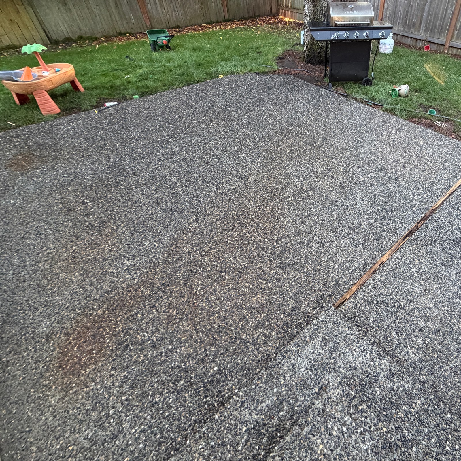 After: exposed aggregate patio pressure washing by Peterson Property Services in Mill Creek, WA